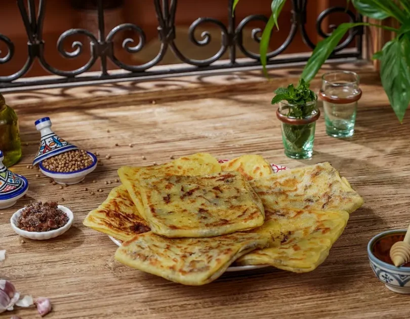 Msemen Breakfast Wraps with Khlii, Soft Eggs, and Tomato-Cumin Salad